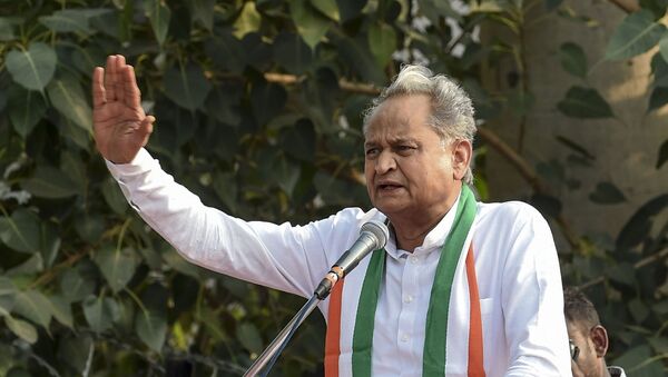Rajasthan state's Chief Minister Ashok Gehlot gestures as he speaks during a 'Janvedna Yatra' (rally) against the price rise of onions and vegetables, in Ahmedabad on November 30, 2019 - Sputnik International