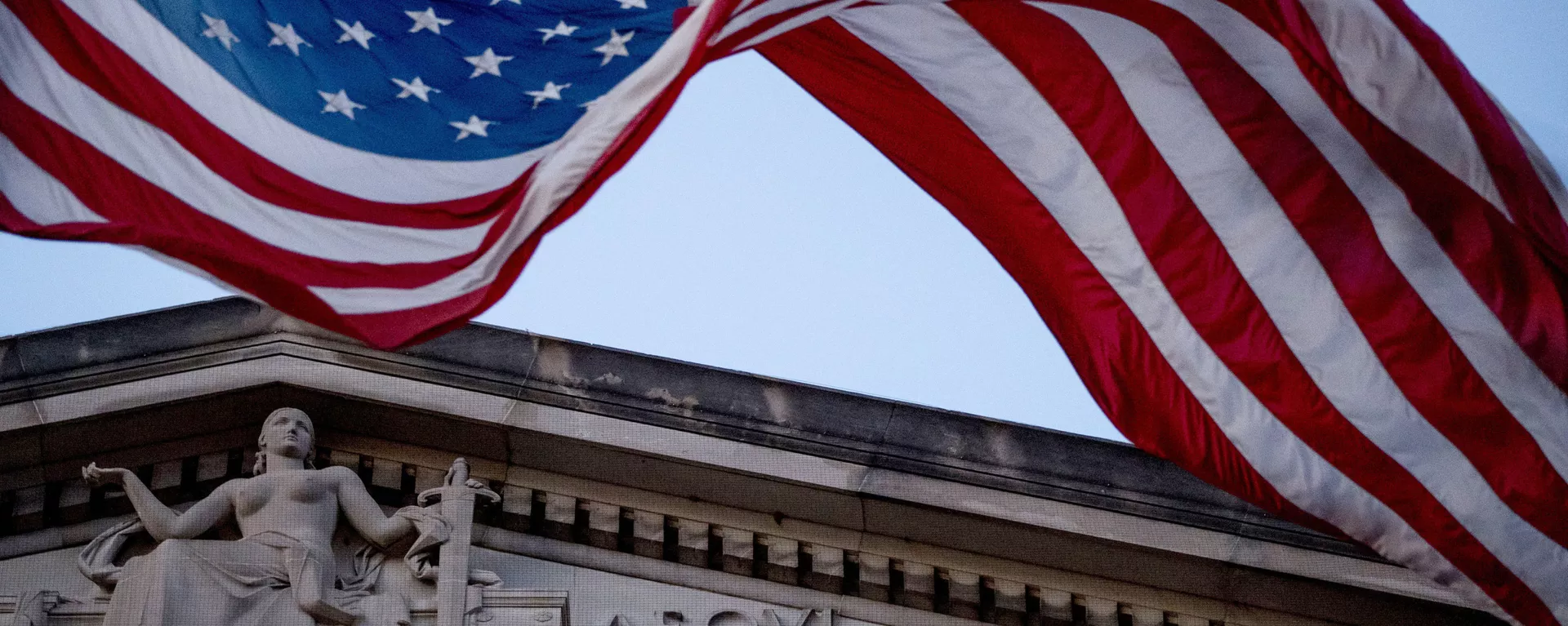 In this March 22, 2019 file photo, an American flag flies outside the Department of Justice in Washington - Sputnik International, 1920, 25.09.2024