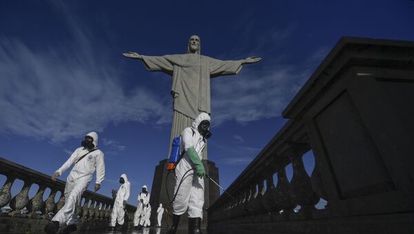 Soldiers of the Brazilian Armed Forces are seen during the disinfection procedures of the Christ The Redeemer statue at Corcovado mountain prior to the opening of the touristic attraction on 15 August, in Rio de Janeiro, Brazil, on 13 August, 2020, amid the COVID-19 pandemic.  - Sputnik International