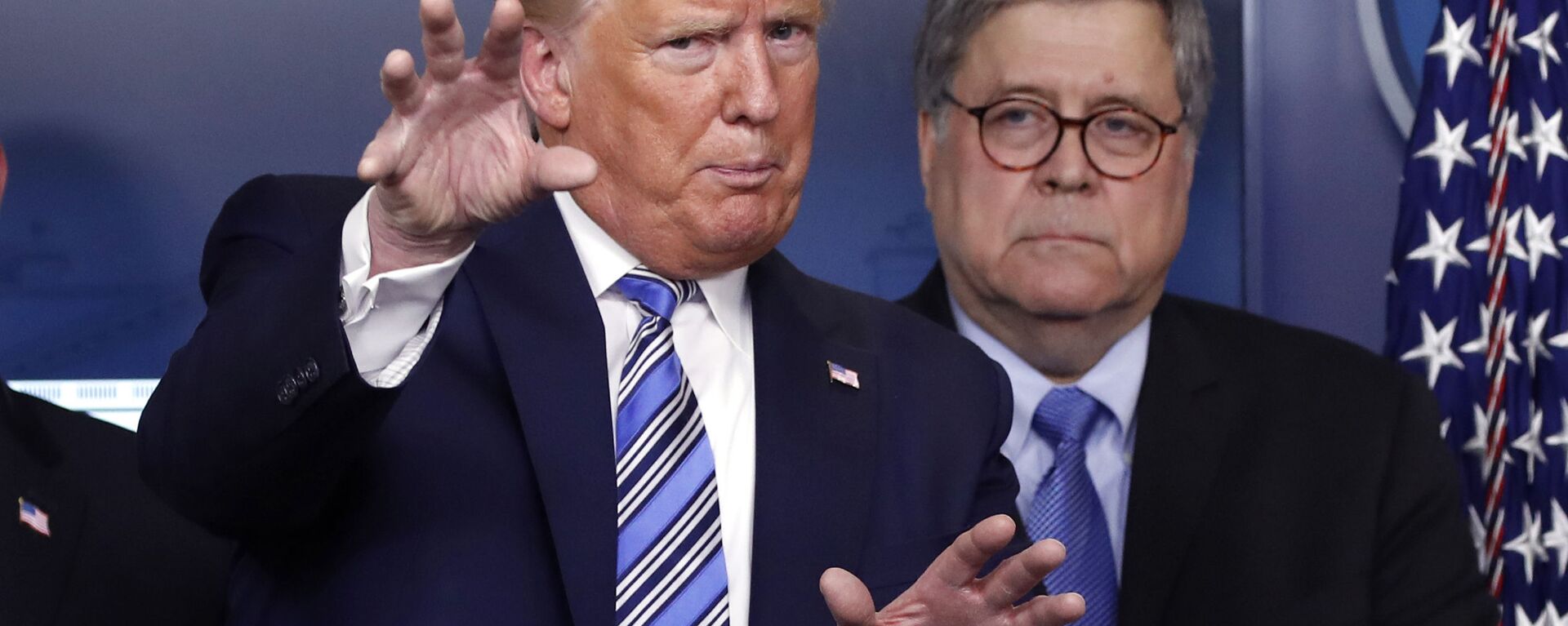 In this March 23, 2020 file photo, President Donald Trump talks during a briefing about the coronavirus in the James Brady Briefing Room, Monday, March 23, 2020, in Washington, as Attorney General William Barr looks on. - Sputnik International, 1920, 17.09.2021