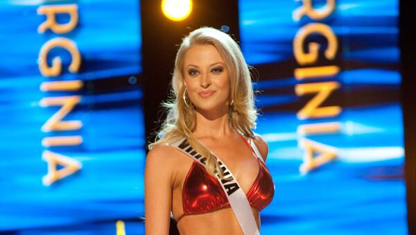 Miss Virginia USA 2011, Nikki Poteet, from Richmond, competes in her swimwear by Kandy Wrappers during the 2011 Miss USA Presentation Show on Wednesday, June 15, 2011 from the Planet Hollywood Resort and Casino Theatre for the Performing Arts in Las Vegas, Nevada. - Sputnik International