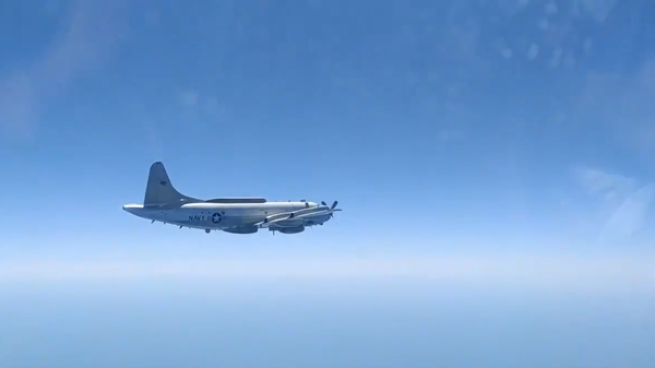 US Navy EP-3E Aries II filmed from the cockpit of the Russian Sukhoi Su-27 fighter jet sent to intercept it, Saturday, August 15, 2020. - Sputnik International