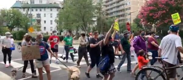 Demonstrators in opposition to over recent decisions made by the Postmaster General Louis DeJoy held a protest outside his home in Washington, D.C., on Saturday, demanding support for the US Postal Service (USPS). Demonstrators in opposition to over recent decisions made by the Postmaster General Louis DeJoy held a protest outside his home in Washington, D.C., on Saturday, demanding support for the US Postal Service (USPS). - Sputnik International