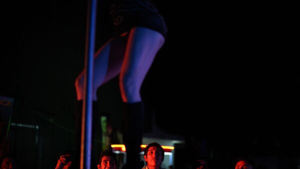 In this photo taken on Friday, March 2, 2012, an exotic dancer performs during the 2012 Sex and Entertainment Expo in Mexico City.  The Sex and Entertainment Expo is an annual event where vendors in the sex industry promote their goods and local strip clubs offer a glimpse of their establishments. - Sputnik International