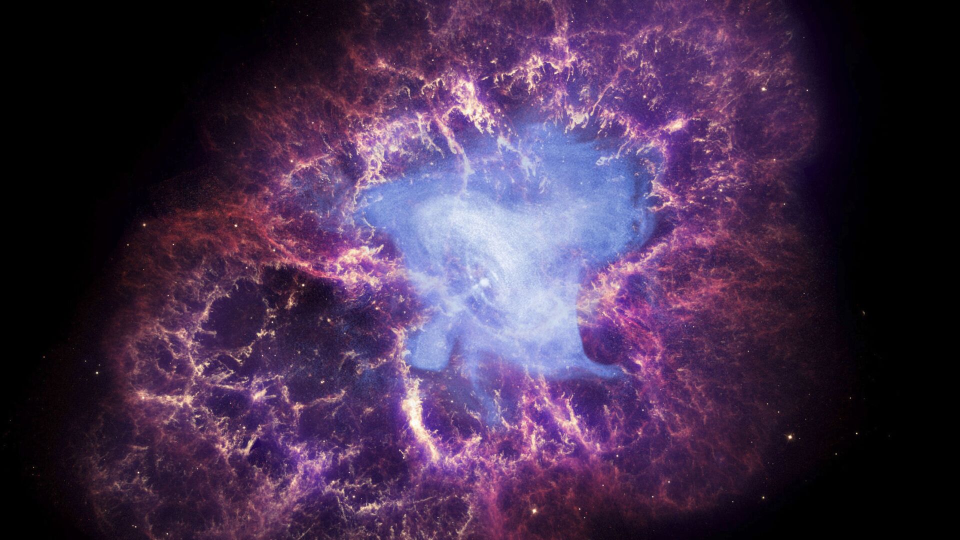 This composite image made available by NASA shows a neutron star, center, left behind by the explosion from the original star's death in the constellation Taurus, observed on Earth as the supernova of A.D. 1054. This image uses data from three of NASA's observatories: the Chandra X-ray image is shown in blue, the Hubble Space Telescope optical image is in red and yellow, and the Spitzer Space Telescope's infrared image is in purple. After nearly two decades in Earth orbit, scanning the universe with infrared eyes, ground controllers plan to put the faltering Spitzer Space Telescope into permanent hibernation on Thursday, Jan. 29, 2020 - Sputnik International, 1920, 03.01.2022