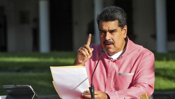 Handout picture released by the Venezuelan Presidency showing Venezuela's President Nicolas Maduro announcing in a televised message to the nation the extension, for the fifth time, of the state of alarm due to the COVID-19 novel coronavirus pandemic, in Caracas on August 9, 2020 - Sputnik International