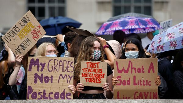 FILE PHOTO: A-level students hold placards as they protest opposite Downing Street, amid the ongoing coronavirus (COVID-19) pandemic, in London, Britain, 16 August 2020.  - Sputnik International