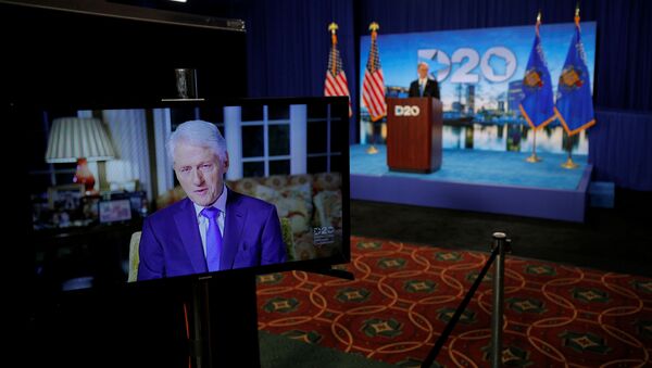 Former President Bill Clinton delivers a speech by video feed as Democratic National Committee Chairman Tom Perez watches from the podium during the second night of the virtual 2020 Democratic National Convention at its hosting site in Milwaukee, Wisconsin, U.S. August 18, 2020 - Sputnik International