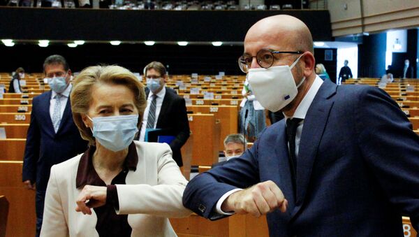 European Commission President Ursula Von Der Leyen and European Council President Charles Michel greet each-other with an elbow bump during a plenary session on the conclusions of the extraordinary European Council meeting at the European Parliament in Brussels, Belgium July 23, 2020 - Sputnik International