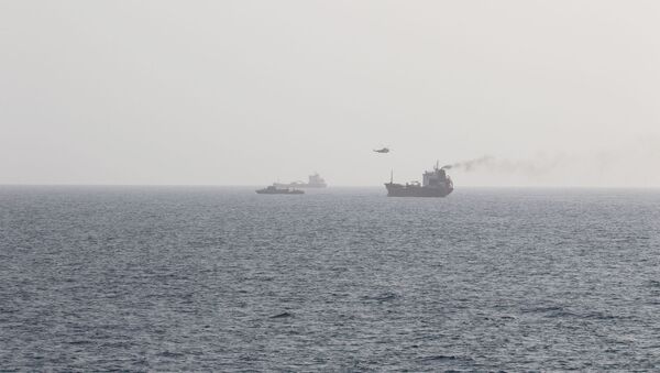 This picture released by the U.S. Navy allegedly shows members of the Iranian forces fast-roping onto civilian tanker WILA en-route to the UAE from a Sea King helicopter, in international waters in the Strait of Hormuz, August 12, 2020 - Sputnik International