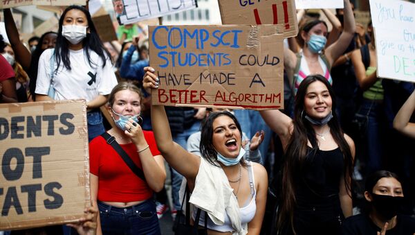 A level students hold placards as they protest outside the Department for Education, amid the outbreak of the coronavirus disease (COVID-19), in London, Britain, August 16, 2020.  - Sputnik International