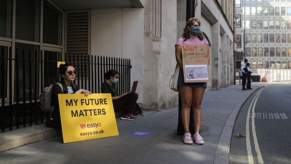 People take part in a protest over the governments handling of exam results, outside the Department for Education, amid the spread of the coronavirus disease (COVID-19), in London, Britain, August 22, 2020. - Sputnik International