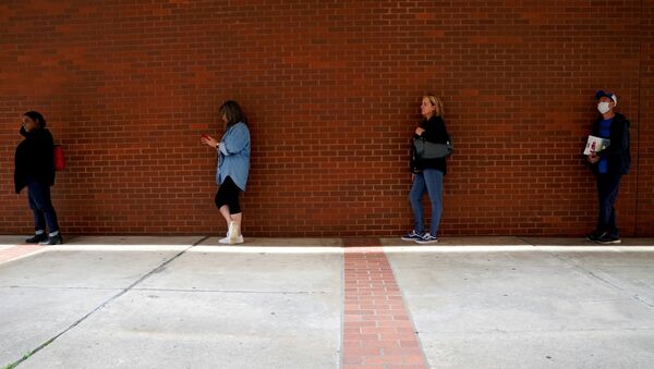 People who lost their jobs wait in line to file for unemployment benefits, following an outbreak of the coronavirus disease (COVID-19), at Arkansas Workforce Center in Fort Smith, Arkansas, U.S. April 6, 2020 - Sputnik International