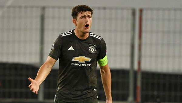  Soccer Football - Europa League Semi Final - Sevilla v Manchester United - RheinEnergieSTADION, Cologne, Germany - August 16, 2020  Manchester United's Harry Maguire reacts, as play resumes behind closed doors following the outbreak of the coronavirus disease (COVID-19) - Sputnik International