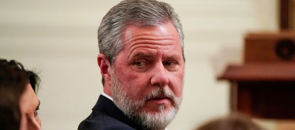 Jerry Falwell Jr., president of Liberty University, awaits the arrival of U.S. President Donald Trump to sign an executive order linking free speech efforts at public universities to federal grants in the East Room at the White House in Washington, U.S., March 21, 2019. - Sputnik International