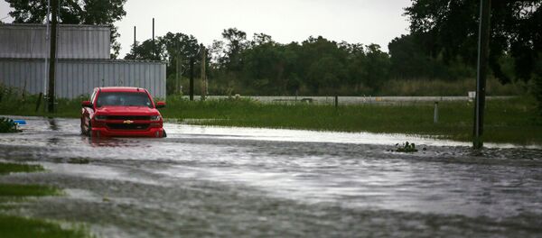 A car near Vermilion Bay is seen partially submerged in waters brought by Hurricane Laura approaching Abbeville, Louisiana, U.S., August 26, 2020 - Sputnik International