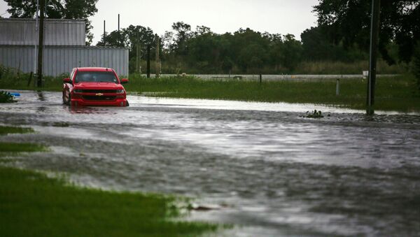 A car near Vermilion Bay is seen partially submerged in waters brought by Hurricane Laura approaching Abbeville, Louisiana, U.S., August 26, 2020 - Sputnik International