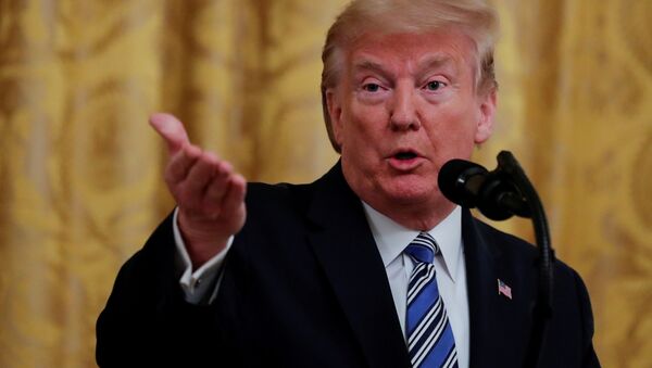 FILE PHOTO: U.S. President Donald Trump takes a question as he addresses an East Room event highlighting Paycheck Protection Program (PPP) loans for small businesses adversely affected by the coronavirus disease (COVID-19) outbreak, at the White House in Washington, U.S., April 28, 2020 - Sputnik International