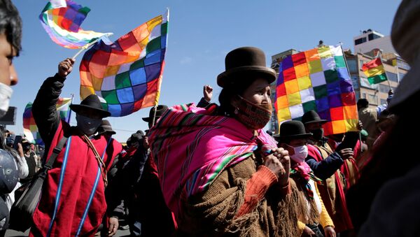 Aymara indigenous attend a rally demanding Bolivia's President Jeanine Anez's (not pictured) resignation, while the Bolivian Union Workers (COB) declare a pause to protests according to local media, amid the coronavirus disease (COVID-19), in El Alto, on the outskirts of La Paz, August 14, 2020 - Sputnik International