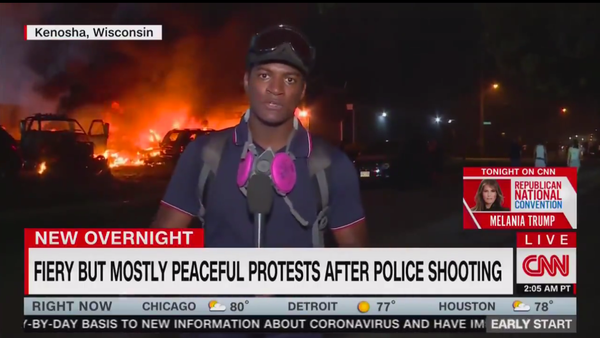 Screenshot of CNN live report from Kenosha protests, dubbed with the chyron FIERY BUT MOSTLY PEACEFUL PROTESTS AFTER POLICE SHOOTING - Sputnik International