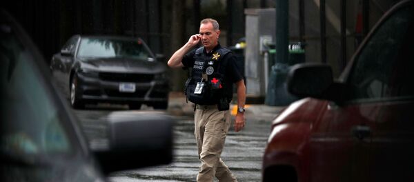 A Secret Service officer walks near the entrance to the Republican National Convention, in Charlotte, North Carolina, U.S., August 24, 2020 - Sputnik International