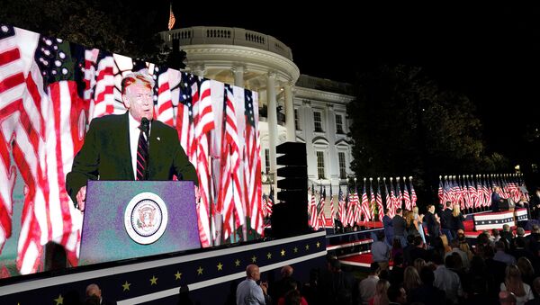 U.S. President Donald Trump is projected in a screen as he delivers his acceptance speech as the 2020 Republican presidential nominee during the final event of the Republican National Convention on the South Lawn of the White House in Washington, U.S., August 27, 2020.  - Sputnik International
