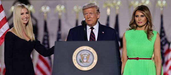 U.S. President Donald Trump looks on alongside to U.S. first lady Melania Trump and White House Senior Adviser Ivanka Trump before delivering his acceptance speech as the 2020 Republican presidential nominee during the final event of the Republican National Convention on the South Lawn of the White House in Washington, U.S., August 27, 2020.  - Sputnik International