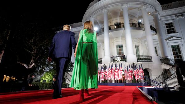 U.S. President Donald Trump walks back into the White House with first lady Melania Trump after delivering his acceptance speech as the 2020 Republican presidential nominee during the final event of the Republican National Convention on the South Lawn of the White House in Washington, U.S., August 27, 2020 - Sputnik International
