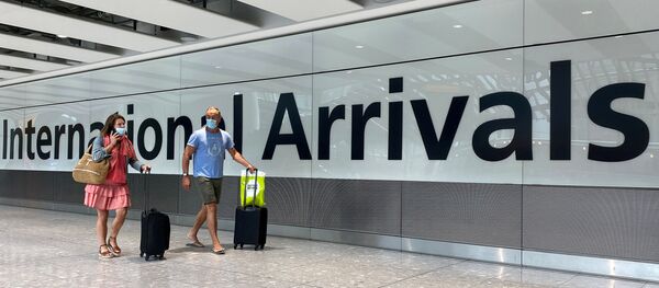 Passengers from international flights arrive at Heathrow Airport, following the outbreak of the coronavirus disease (COVID-19), London, Britain, July 29, 2020 Passengers from international flights arrive at Heathrow Airport, following the outbreak of the coronavirus disease (COVID-19), London, Britain, July 29, 2020 - Sputnik International