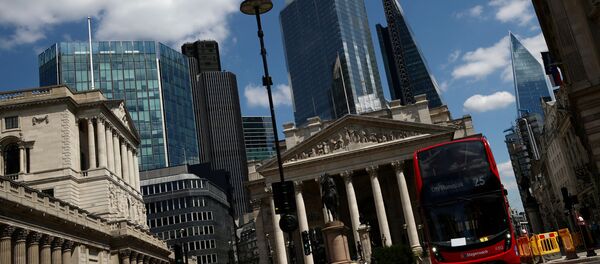 A bus drives on an almost empty street, following the outbreak of the coronavirus disease (COVID-19), in the financial district of London, Britain July 17, 2020.  - Sputnik International
