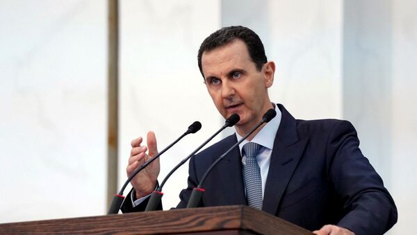 Syria's President Bashar al-Assad addresses the new members of parliament in Damascus, Syria in this handout released by SANA on August 12, 2020. - Sputnik International