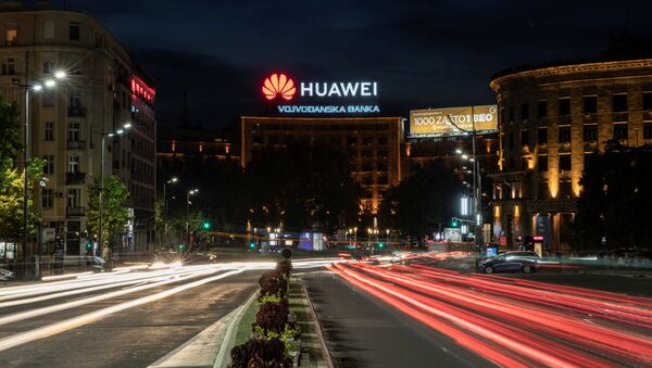 Cars drive past a Huawei logo on a building in central Belgrade, Serbia, August 11, 2020. Picture taken August 11, 2020. Picture taken with a long exposure - Sputnik International