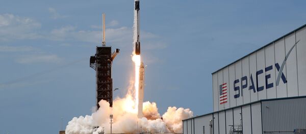 A SpaceX Falcon 9 rocket and Crew Dragon spacecraft carrying NASA astronauts Douglas Hurley and Robert Behnken lifts off during NASA's SpaceX Demo-2 mission to the International Space Station from NASA's Kennedy Space Center in Cape Canaveral, Florida, U.S., May 30, 2020. - Sputnik International