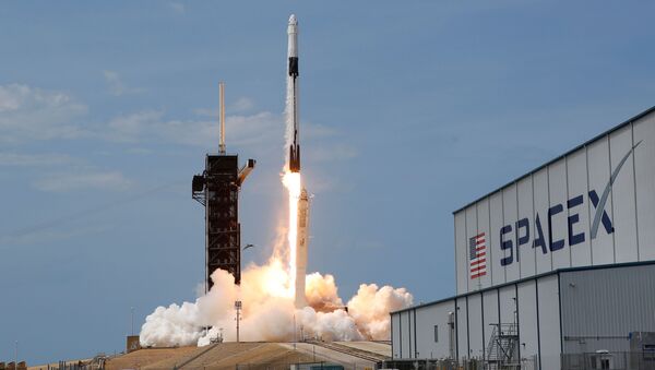 A SpaceX Falcon 9 rocket and Crew Dragon spacecraft carrying NASA astronauts Douglas Hurley and Robert Behnken lifts off during NASA's SpaceX Demo-2 mission to the International Space Station from NASA's Kennedy Space Center in Cape Canaveral, Florida, U.S., May 30, 2020. - Sputnik International