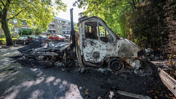 A burnt-out light truck is seen in Rosengard after Friday's night of riots, in Malmo, Sweden, 29 August 2020 - Sputnik International
