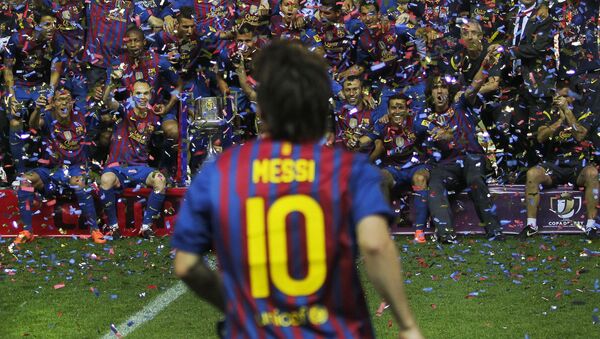 FC Barcelona's Lionel Messi from Argentina, front celebrates with his teammates after the final Copa del Rey soccer match against Athletic Bilbao at the Vicente Calderon stadium in Madrid, Spain, Friday, May 25, 2012.   - Sputnik International