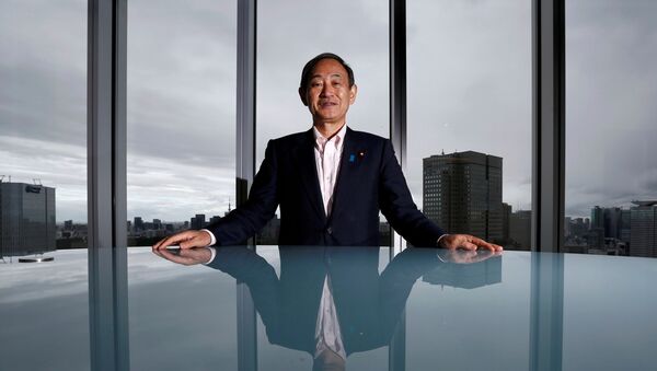Japan's Chief Cabinet Secretary Yoshihide Suga poses for a photograph during a Thomson Reuters Newsmaker event in Tokyo, Japan, 30 August 2016. - Sputnik International