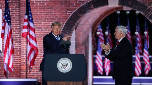 U.S. Vice President Mike Pence is joined onstage by U.S. President Donald Trump after delivering his acceptance speech as the 2020 Republican vice presidential nominee during an event of the 2020 Republican National Convention held at Fort McHenry in Baltimore, Maryland, U.S, August 26, 2020 - Sputnik International