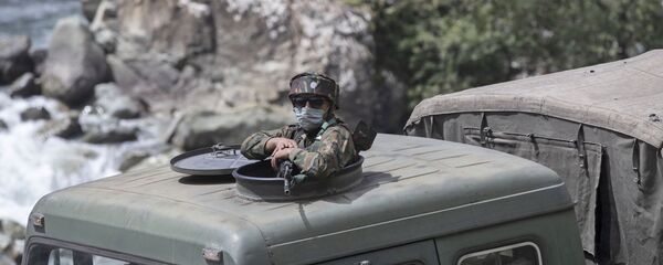An Indian army soldier keeps guard on top of his vehicle as their convoy moves on the Srinagar- Ladakh highway at Gagangeer, northeast of Srinagar, Indian-controlled Kashmir, Tuesday, Sept. 1, 2020 An Indian army soldier keeps guard on top of his vehicle as their convoy moves on the Srinagar- Ladakh highway at Gagangeer, northeast of Srinagar, Indian-controlled Kashmir, Tuesday, Sept. 1, 2020 - Sputnik International