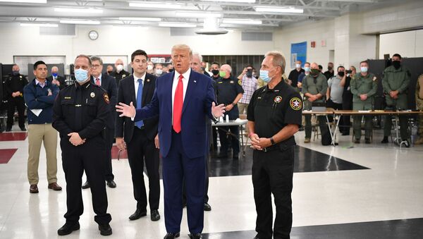 US President Donald Trump speaks with officials on September 1, 2020, at Mary D. Bradford High School in Kenosha, Wisconsin. - Sputnik International