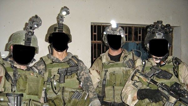 Four mercenaries belonging to Keenie Meenie Services with faces blacked out - Sputnik International