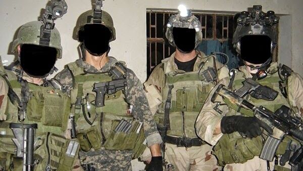 Four mercenaries belonging to Keenie Meenie Services with faces blacked out - Sputnik International