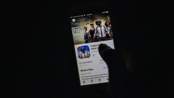 A man looks at the PUBG Mobile game, owned by Chinese internet giant Tencent, in the App Store on an Apple iPhone in New Delhi on September 2, 2020 - Sputnik International