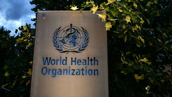 A photo taken in the late hours of August 17, 2020 shows a sign of the World Health Organization (WHO) at their headquarters in Geneva amid the COVID-19 outbreak, caused by the novel coronavirus.  - Sputnik International