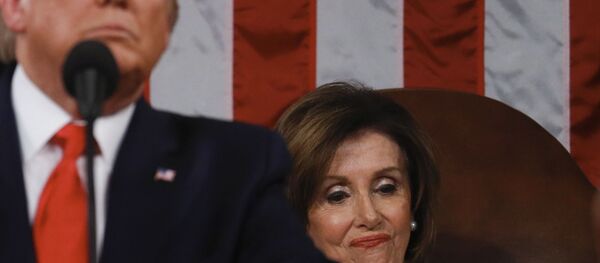 Speaker of the US House of Representatives Nancy Pelosi looks at a copy of US President Donald Trump's speech while he delivers the State of the Union address at the US Capitol in Washington, DC, on February 4, 2020.  - Sputnik International