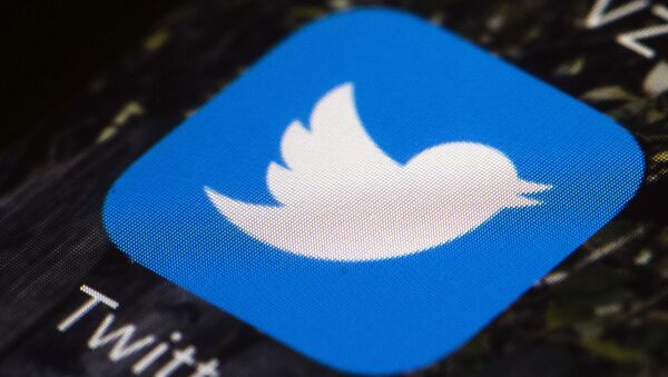 This April 26, 2017, file photo shows the Twitter app icon on a mobile phone in Philadelphia. Reporters at the online news site Insider have been told to take a week off from tweeting at work and to keep TweetDeck off their computer screens. The idea of disengaging is to kick away a crutch for the journalists and escape from the echo chamber, said Julie Zeveloff West, Insider's editor-in-chief for the U.S. - Sputnik International
