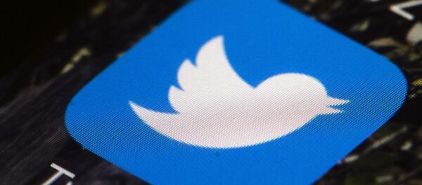 This April 26, 2017, file photo shows the Twitter app icon on a mobile phone in Philadelphia. Reporters at the online news site Insider have been told to take a week off from tweeting at work and to keep TweetDeck off their computer screens. The idea of disengaging is to kick away a crutch for the journalists and escape from the echo chamber, said Julie Zeveloff West, Insider's editor-in-chief for the U.S. - Sputnik International