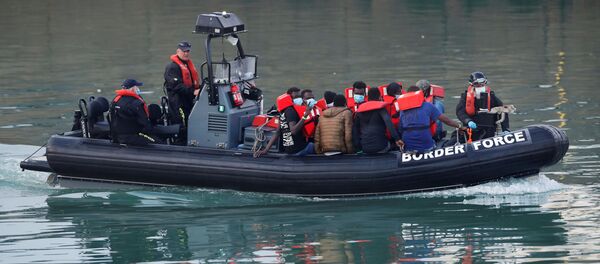Migrants are brought to Dover harbour by Border Force, in Dover, Britain August 12, 2020 Migrants are brought to Dover harbour by Border Force, in Dover, Britain August 12, 2020 - Sputnik International