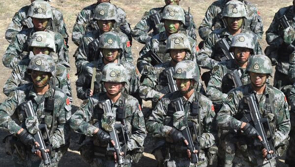 People's Liberation Army (PLA) of China soldiers line up after participating in an anti-terror drill during the Sixth India-China Joint Training exercise Hand in Hand 2016 at HQ 330 Infantry Brigade, in Aundh in Pune district, some 145km southeast of Mumbai, on November 25, 2016. - Sputnik International