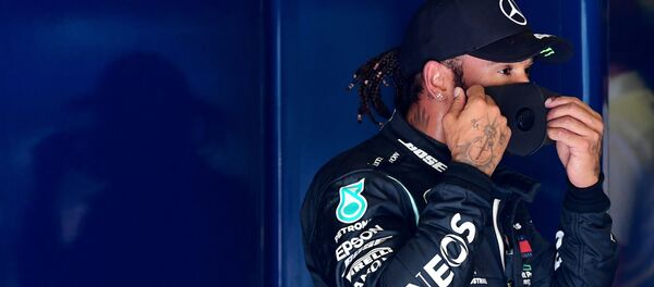Formula One F1 - Italian Grand Prix - Autodromo Nazionale Monza, Monza, Italy - September 5, 2020  Mercedes' Lewis Hamilton reacts after qualifying in pole position - Sputnik International
